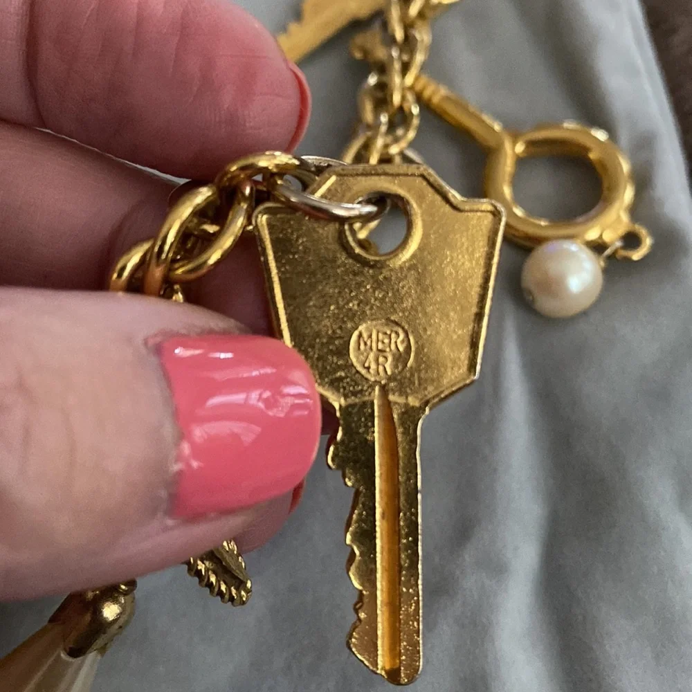 Vintage 1980s Rare Moschino Redwall 15 iconic brand gold charm necklace